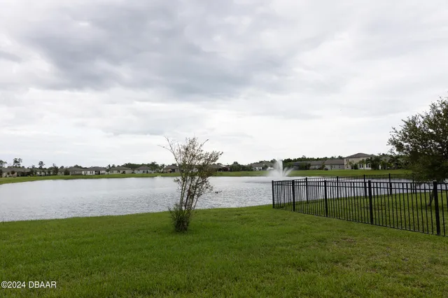 a view of a lake with a big yard