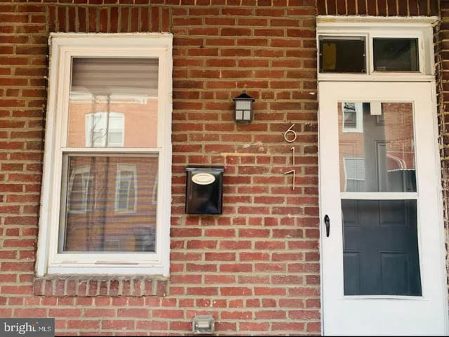 a view of a brick house with a window