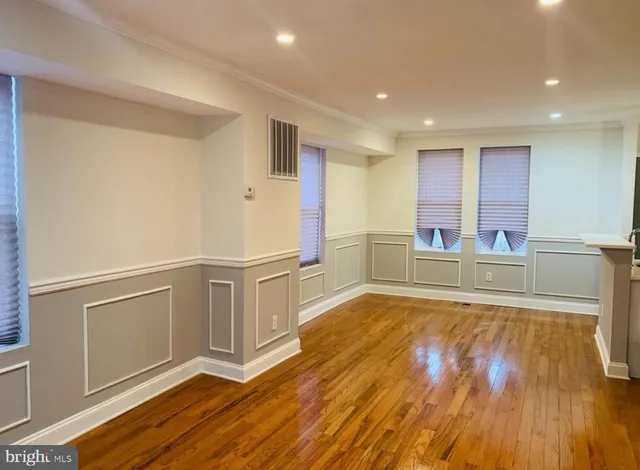 a view of a kitchen with wooden floor