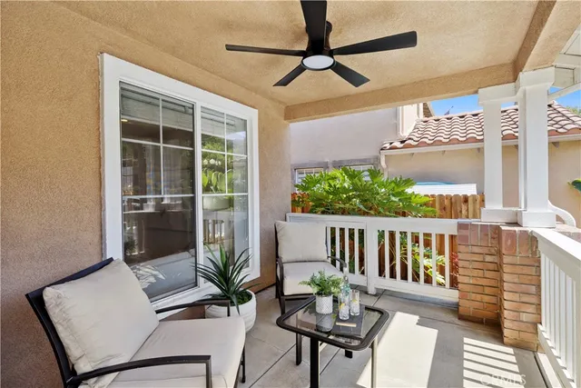 a view of a balcony with furniture