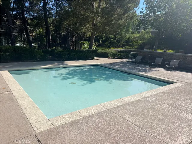 a view of a swimming pool with a yard