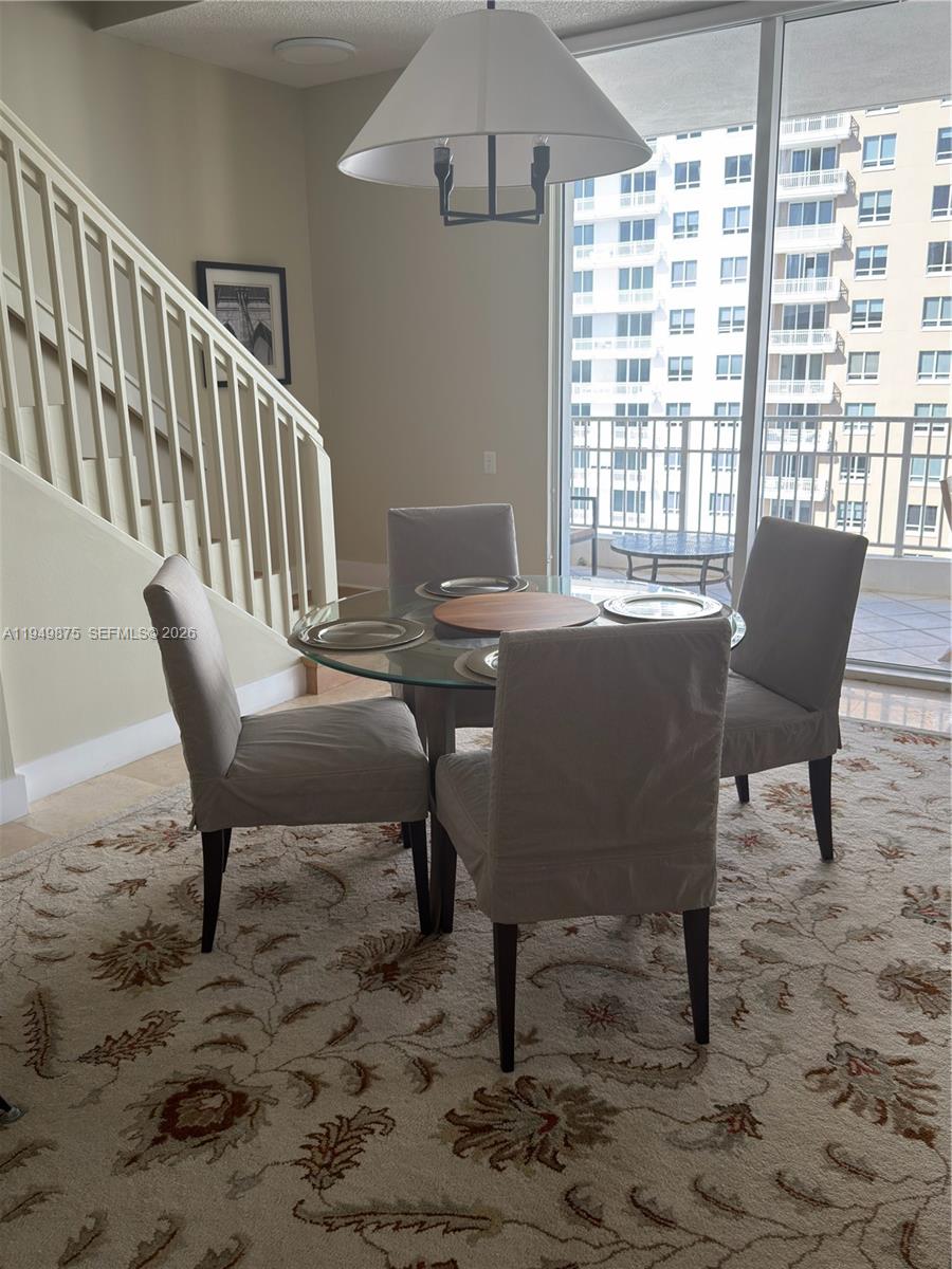 a view of a dining room with furniture window and outside view