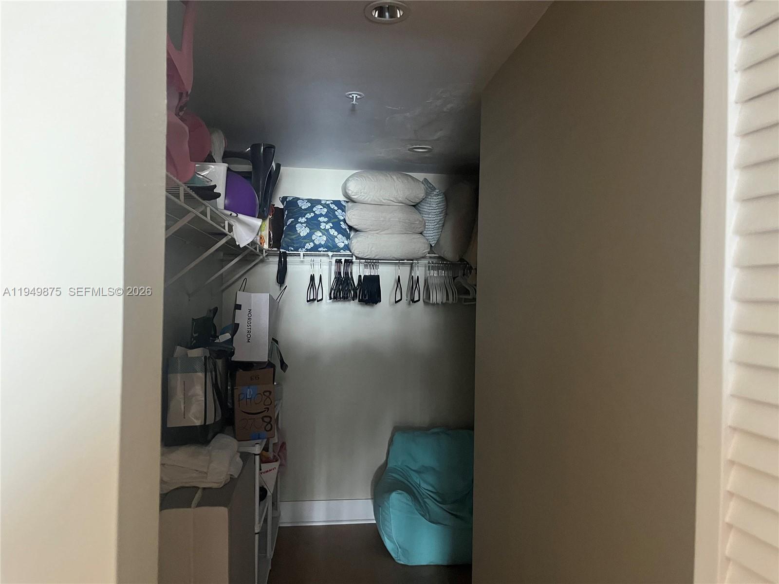 701 Brickell Key Boulevard, Unit PH08 Miami, FL 33131 - Photo 3 of 7 a view of living room with furniture and a window