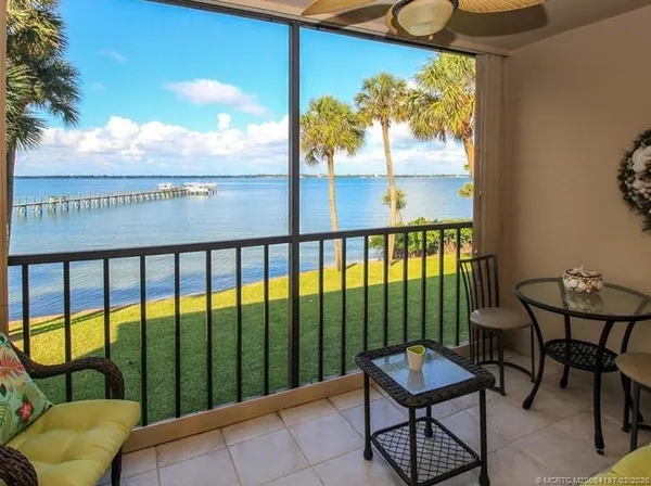 a view of a balcony with chairs