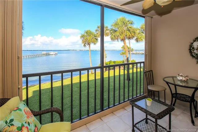 a bedroom with a bed and a table