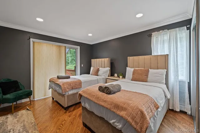 a bedroom with bed and a window