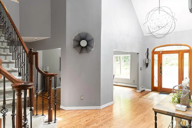 a view of an entryway with wooden floor