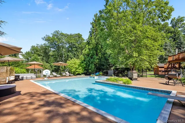 a view of a yard with swimming pool