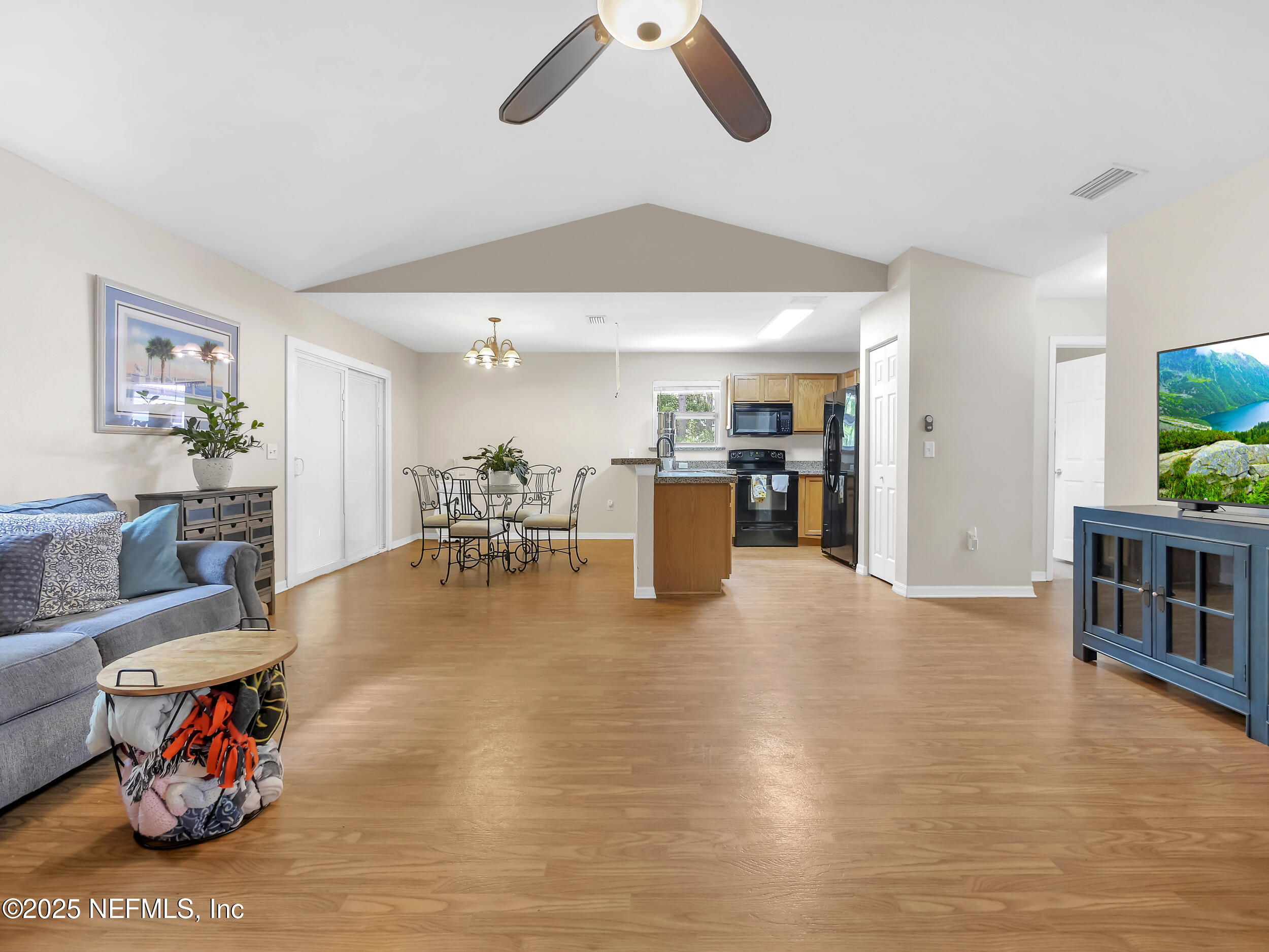 1193 4 Mile Road St. Augustine, FL 32084 - Photo 14 of 54 a living room with furniture and a wooden floor