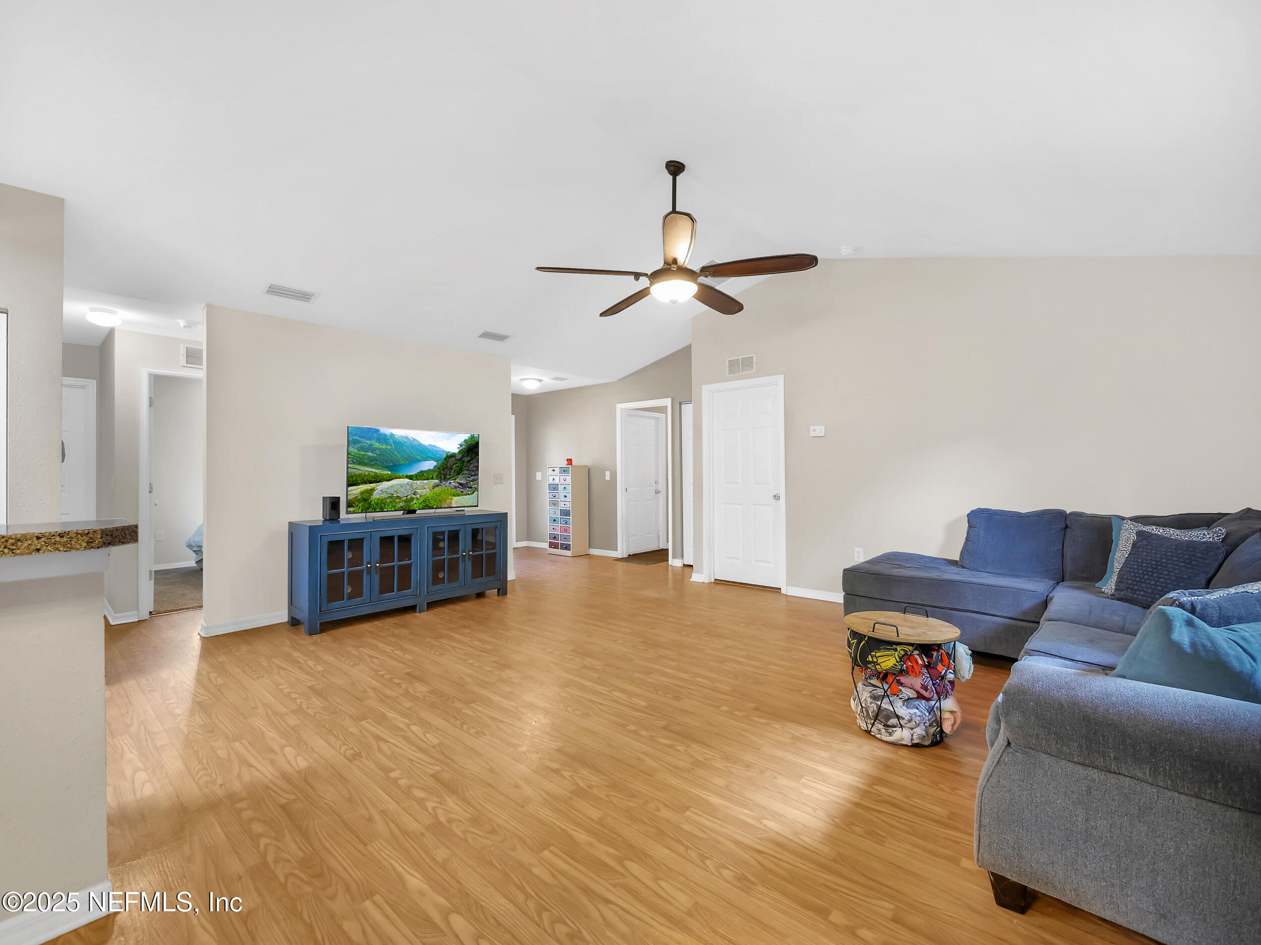 1193 4 Mile Road St. Augustine, FL 32084 - Photo 15 of 54 a living room with furniture and kitchen view