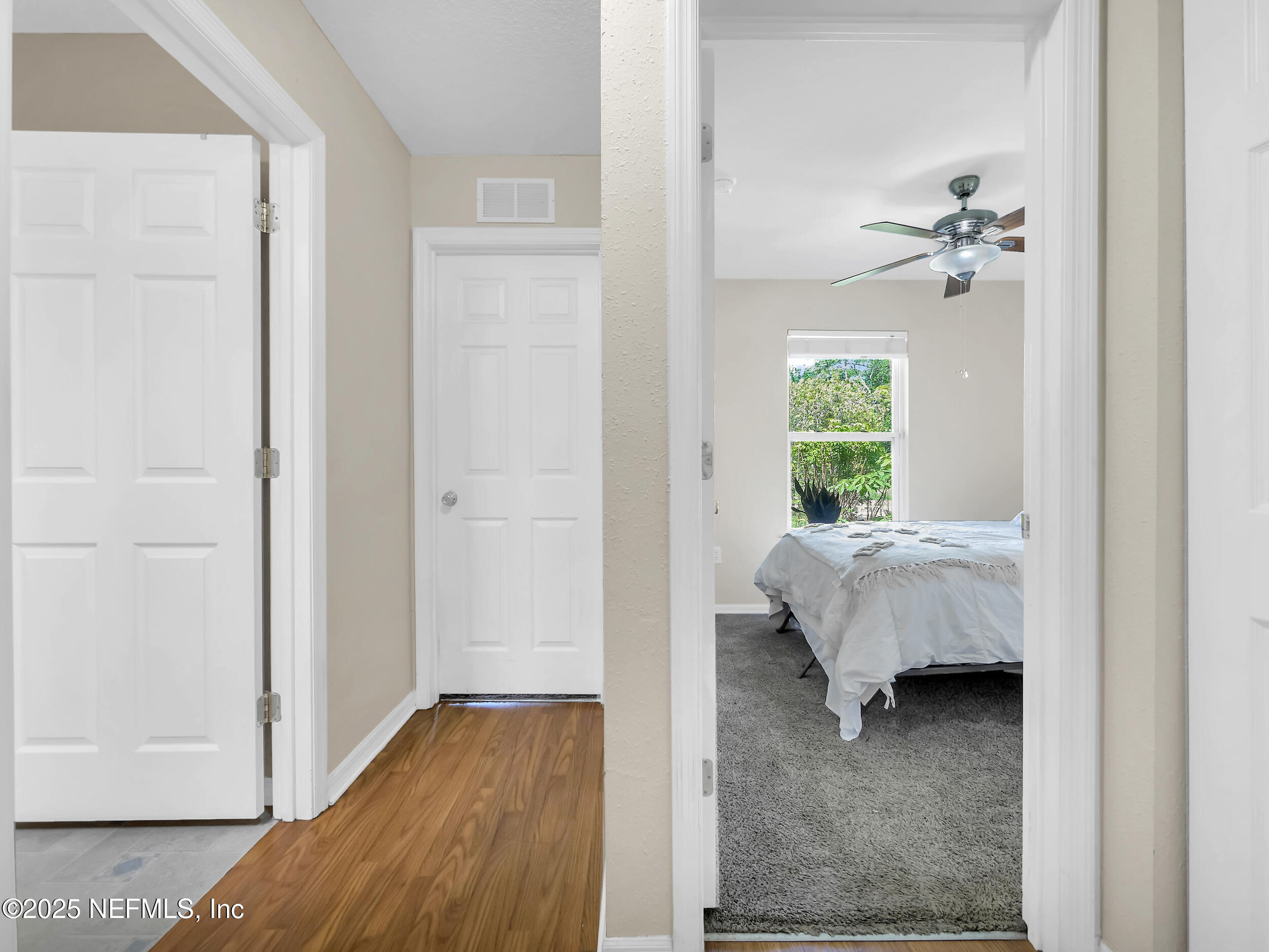 1193 4 Mile Road St. Augustine, FL 32084 - Photo 21 of 54 a bedroom with a bed and a window