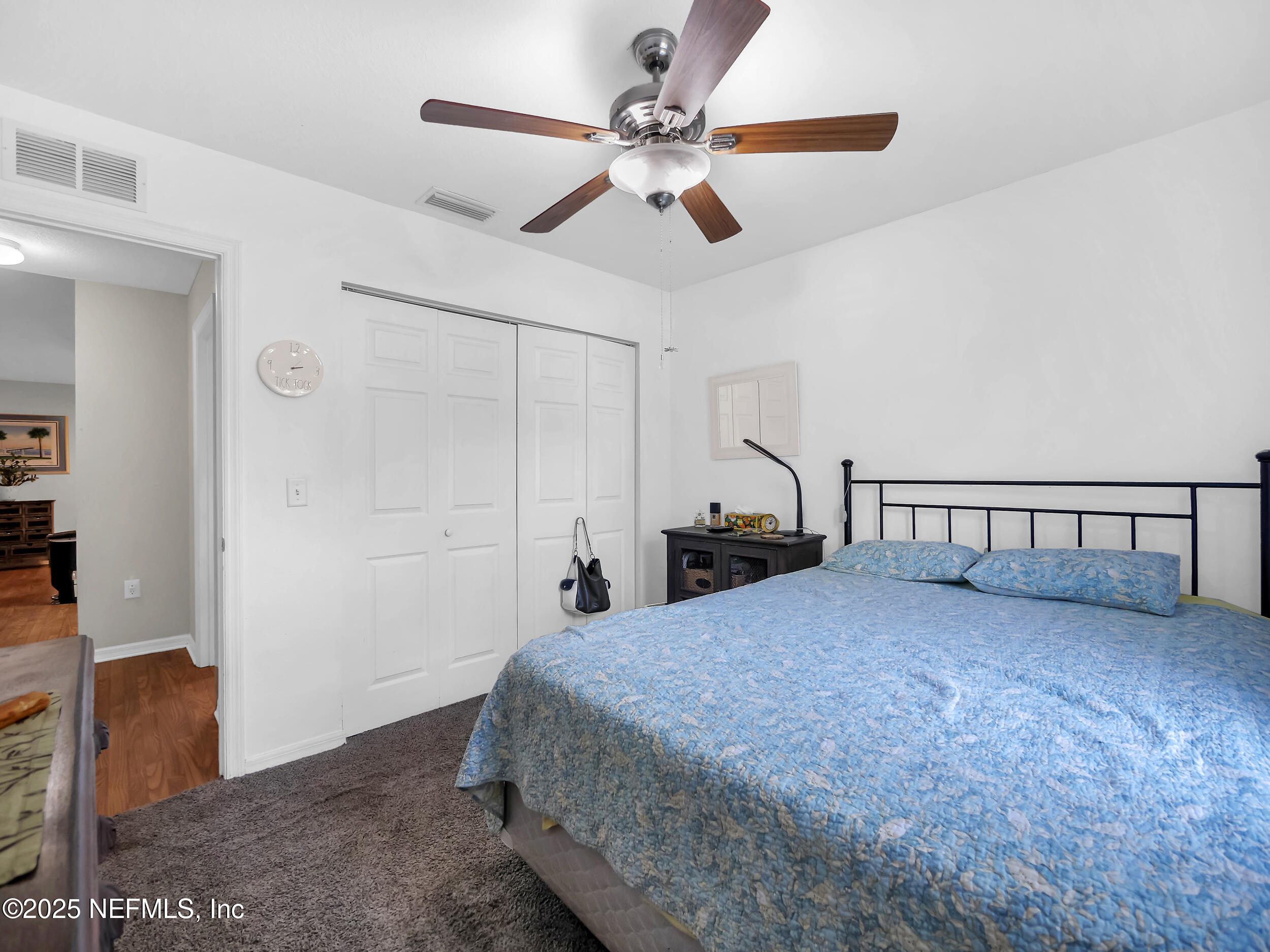 1193 4 Mile Road St. Augustine, FL 32084 - Photo 24 of 54 a bedroom with a bed and a ceiling fan