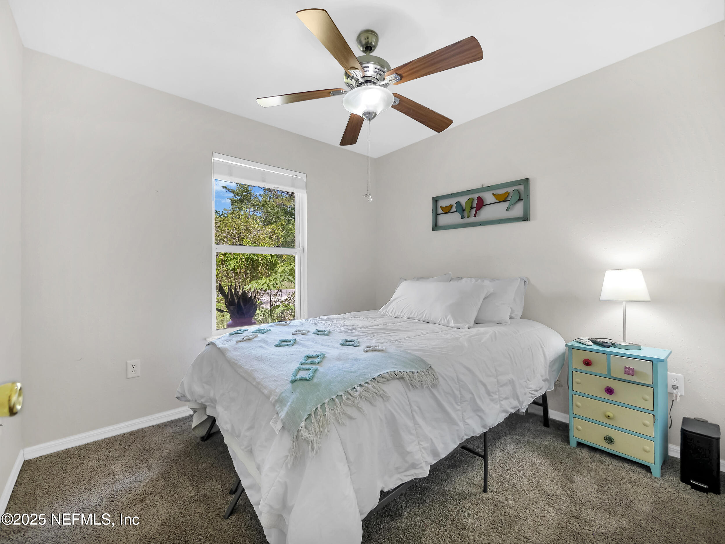 1193 4 Mile Road St. Augustine, FL 32084 - Photo 25 of 54 a bedroom with a bed and a window