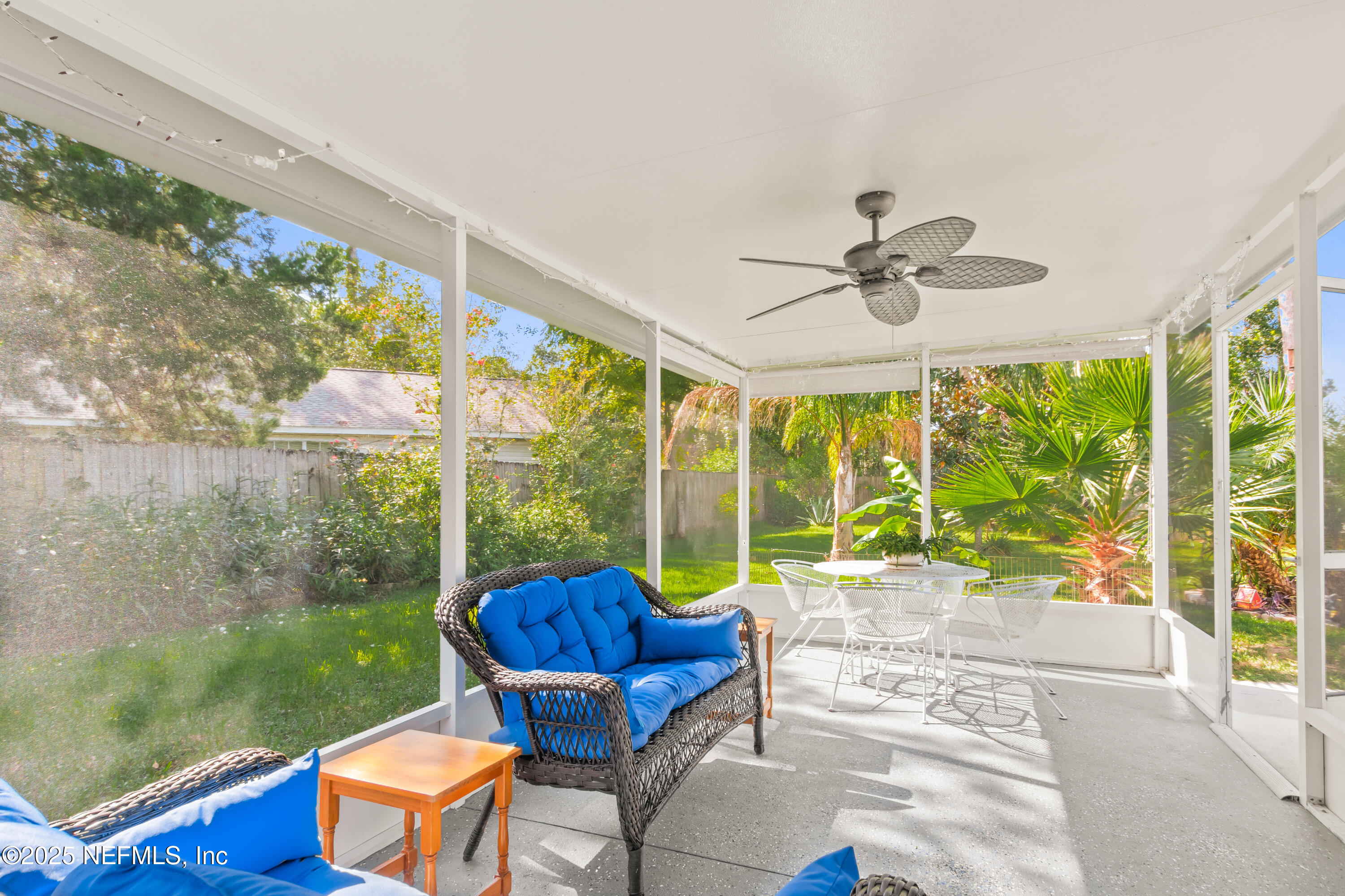 1193 4 Mile Road St. Augustine, FL 32084 - Photo 27 of 54 a view of a porch with furniture and a yard