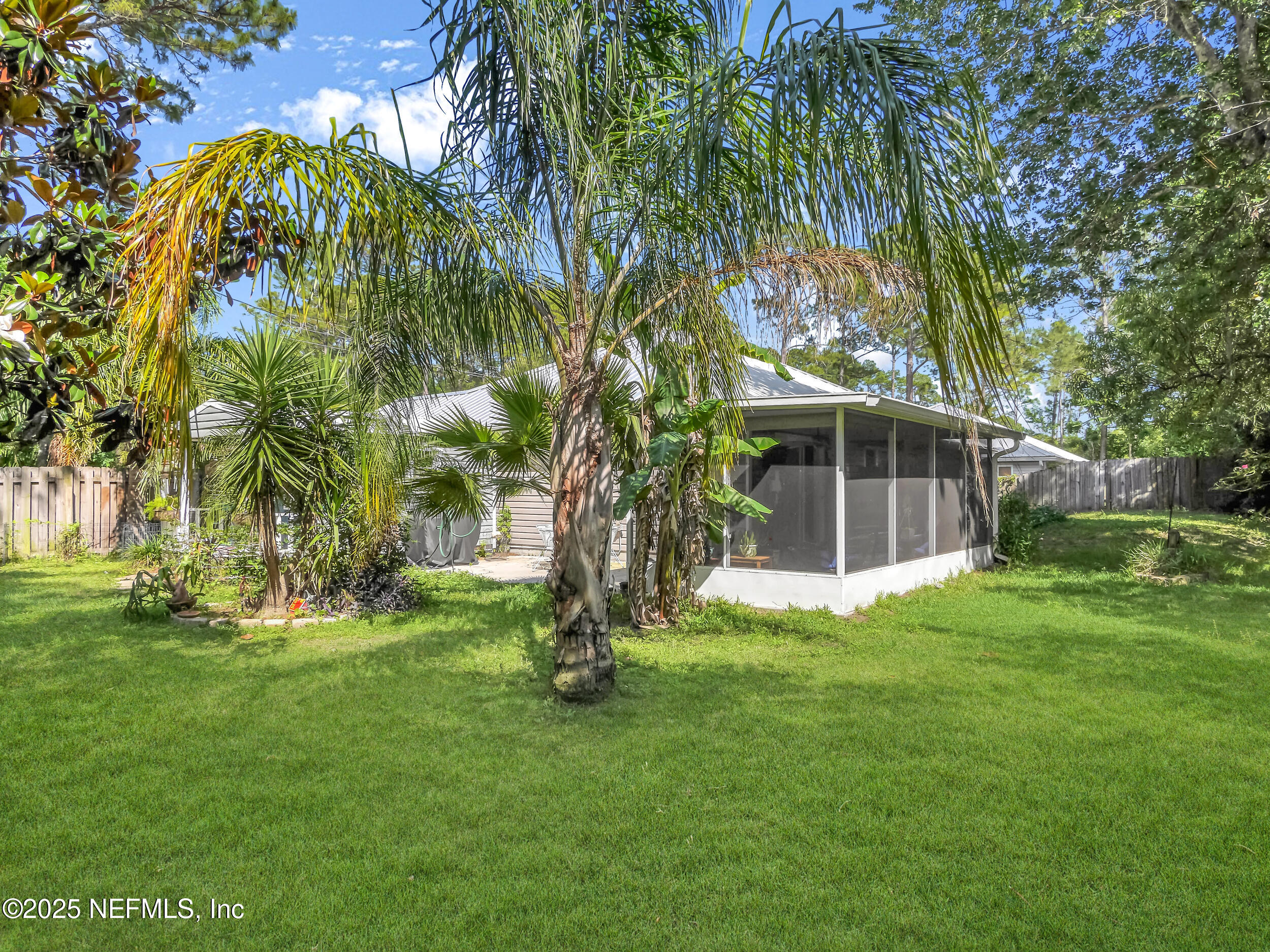 1193 4 Mile Road St. Augustine, FL 32084 - Photo 30 of 54 a view of a backyard with a garden