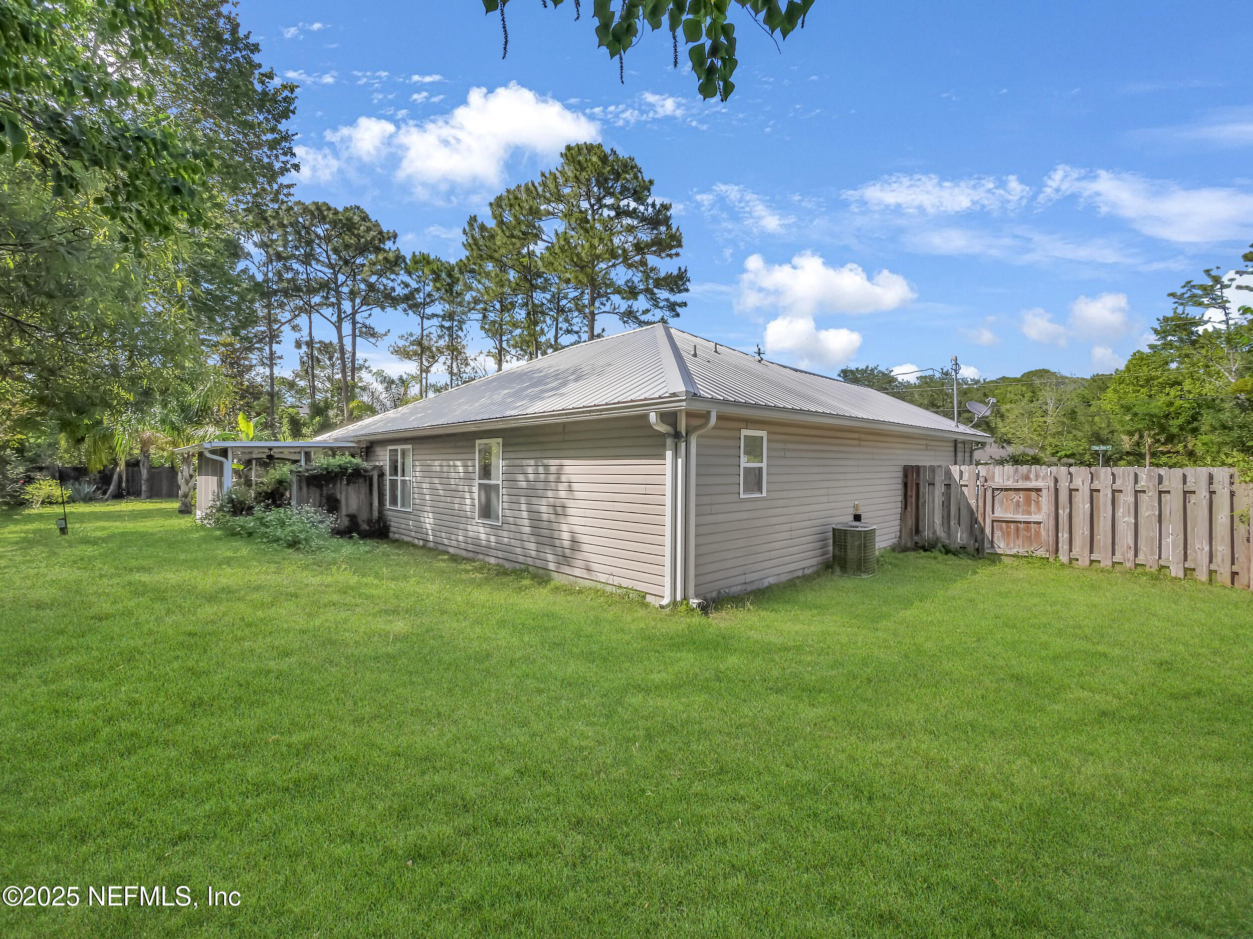 1193 4 Mile Road St. Augustine, FL 32084 - Photo 31 of 54 a view of a house with a yard