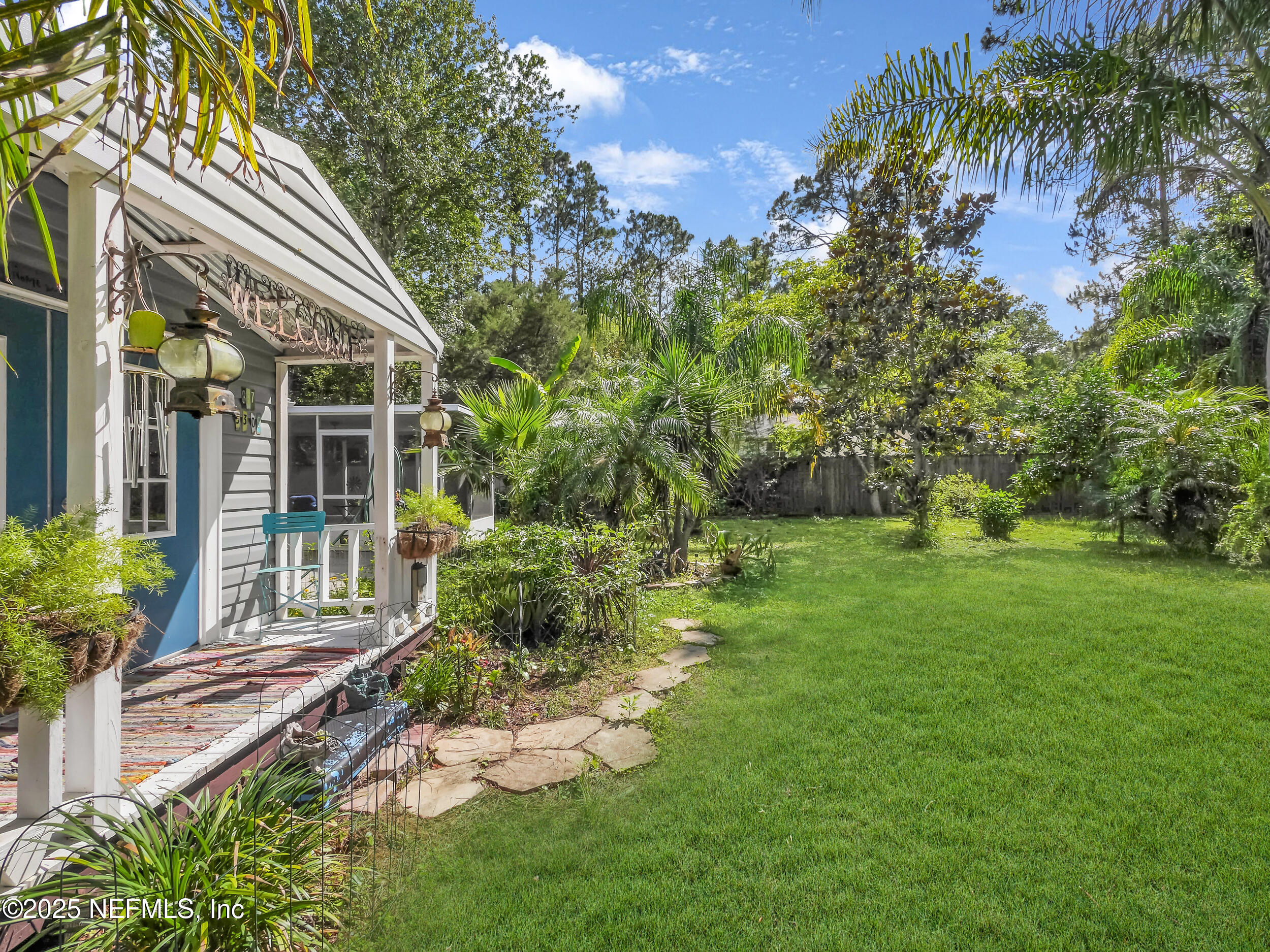 1193 4 Mile Road St. Augustine, FL 32084 - Photo 33 of 54 a front view of a house with a yard
