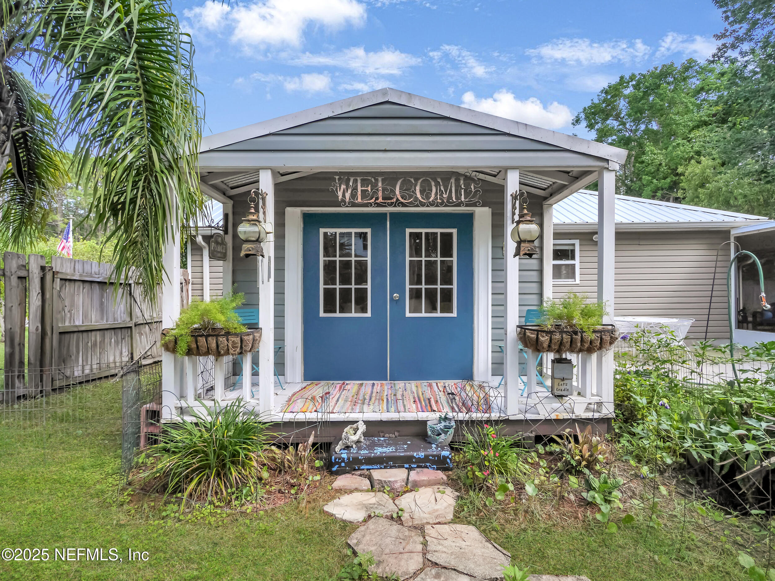 1193 4 Mile Road St. Augustine, FL 32084 - Photo 34 of 54 a front view of a house with garden