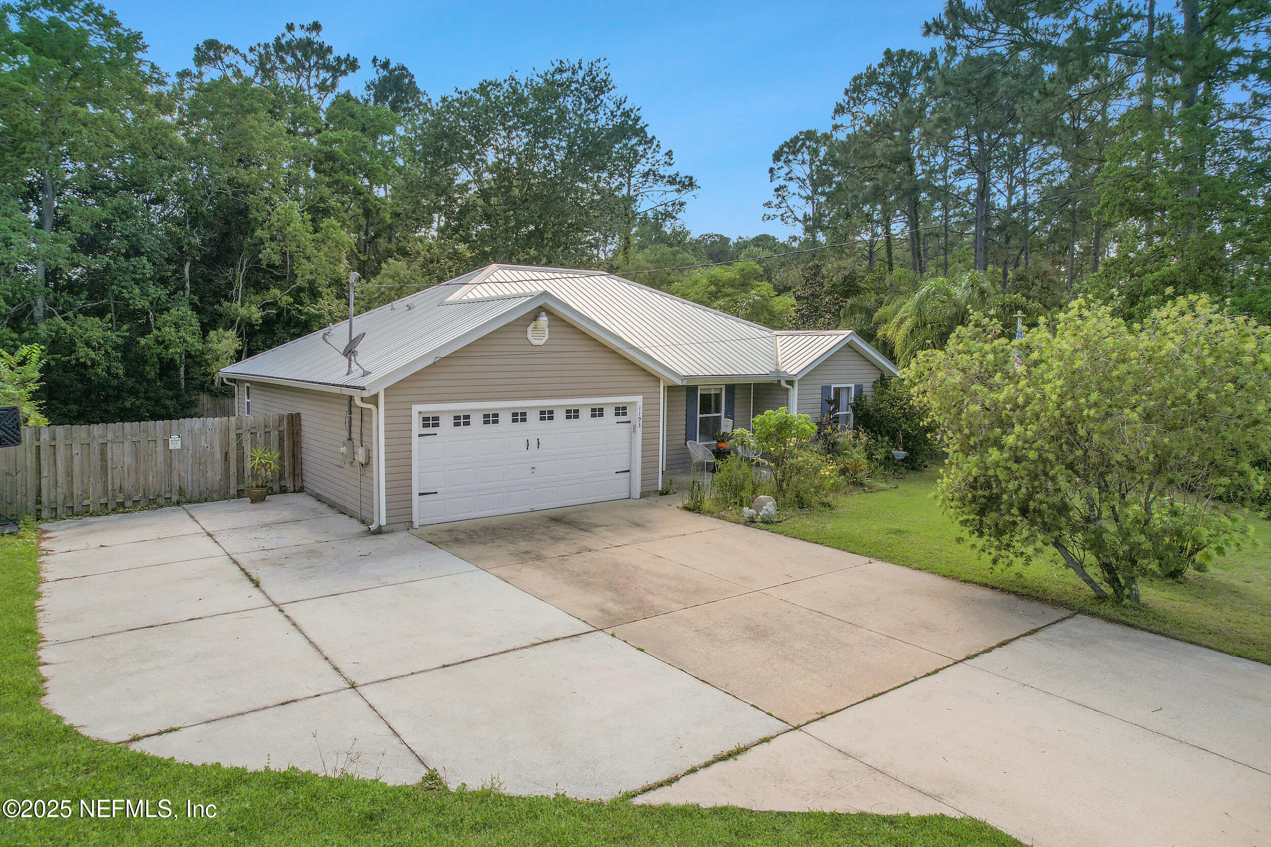 1193 4 Mile Road St. Augustine, FL 32084 - Photo 49 of 54 a view of a house with a yard and large tree