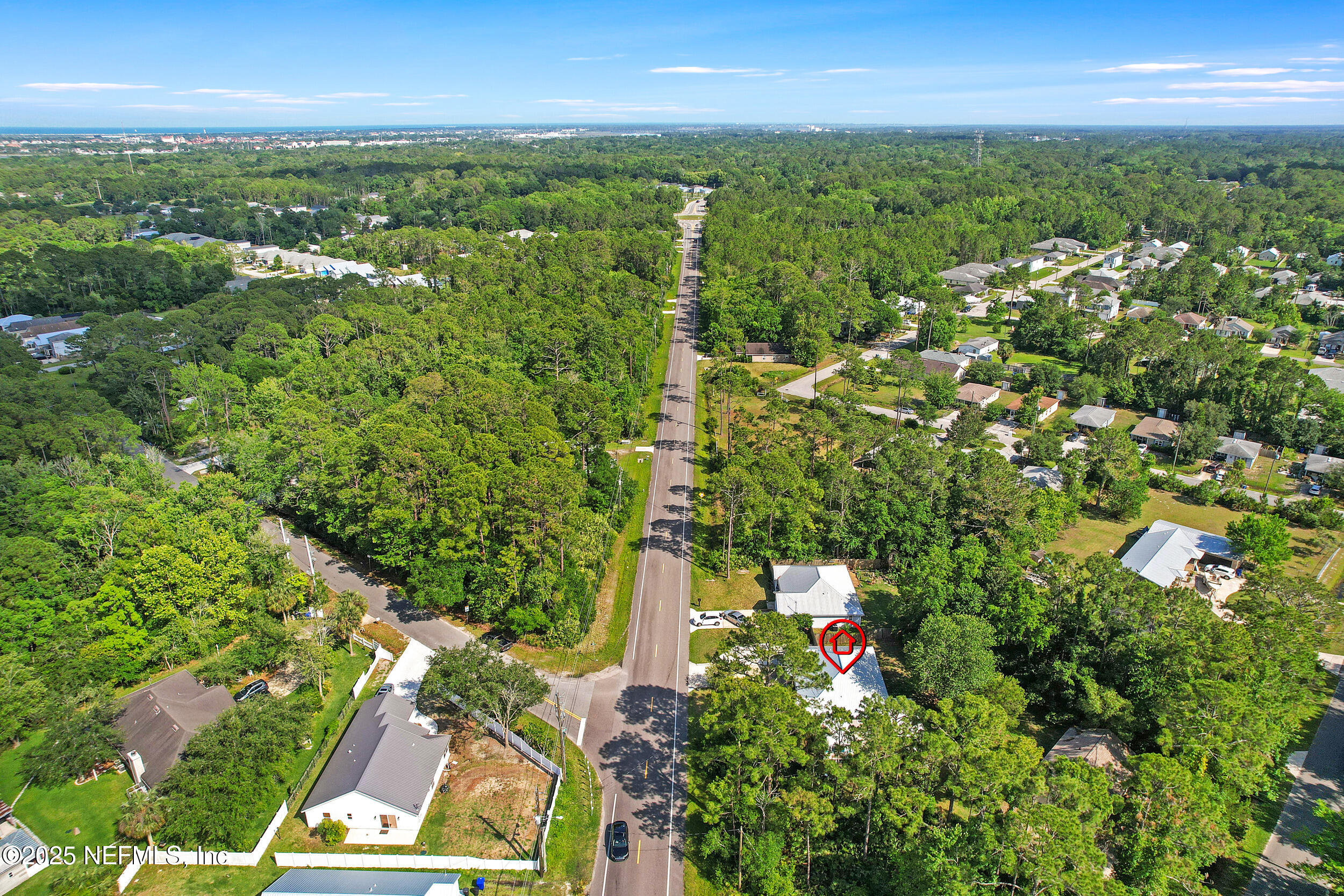1193 4 Mile Road St. Augustine, FL 32084 - Photo 51 of 54 an aerial view of residential houses with outdoor space and trees
