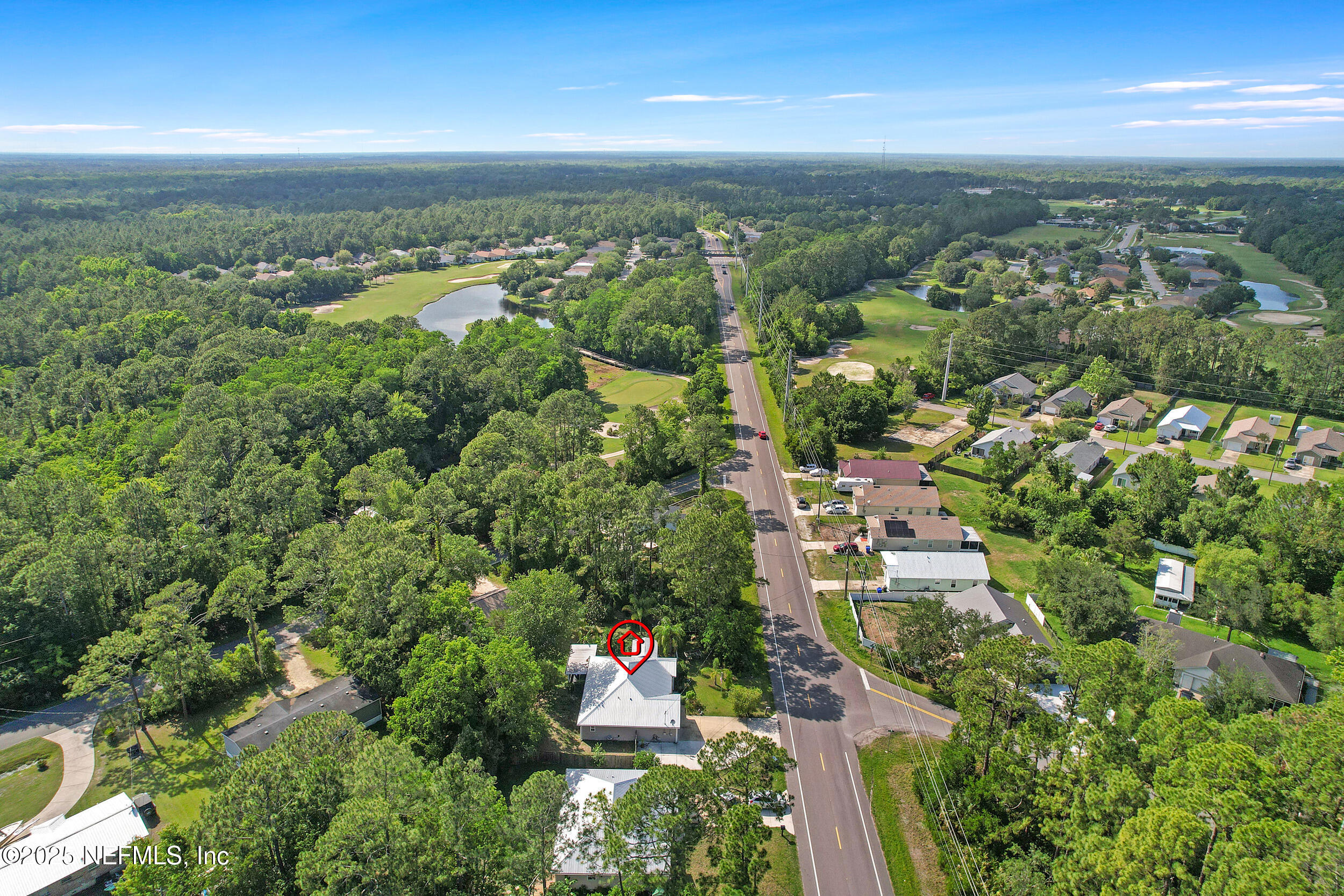 1193 4 Mile Road St. Augustine, FL 32084 - Photo 54 of 54 an aerial view of residential houses with outdoor space and trees