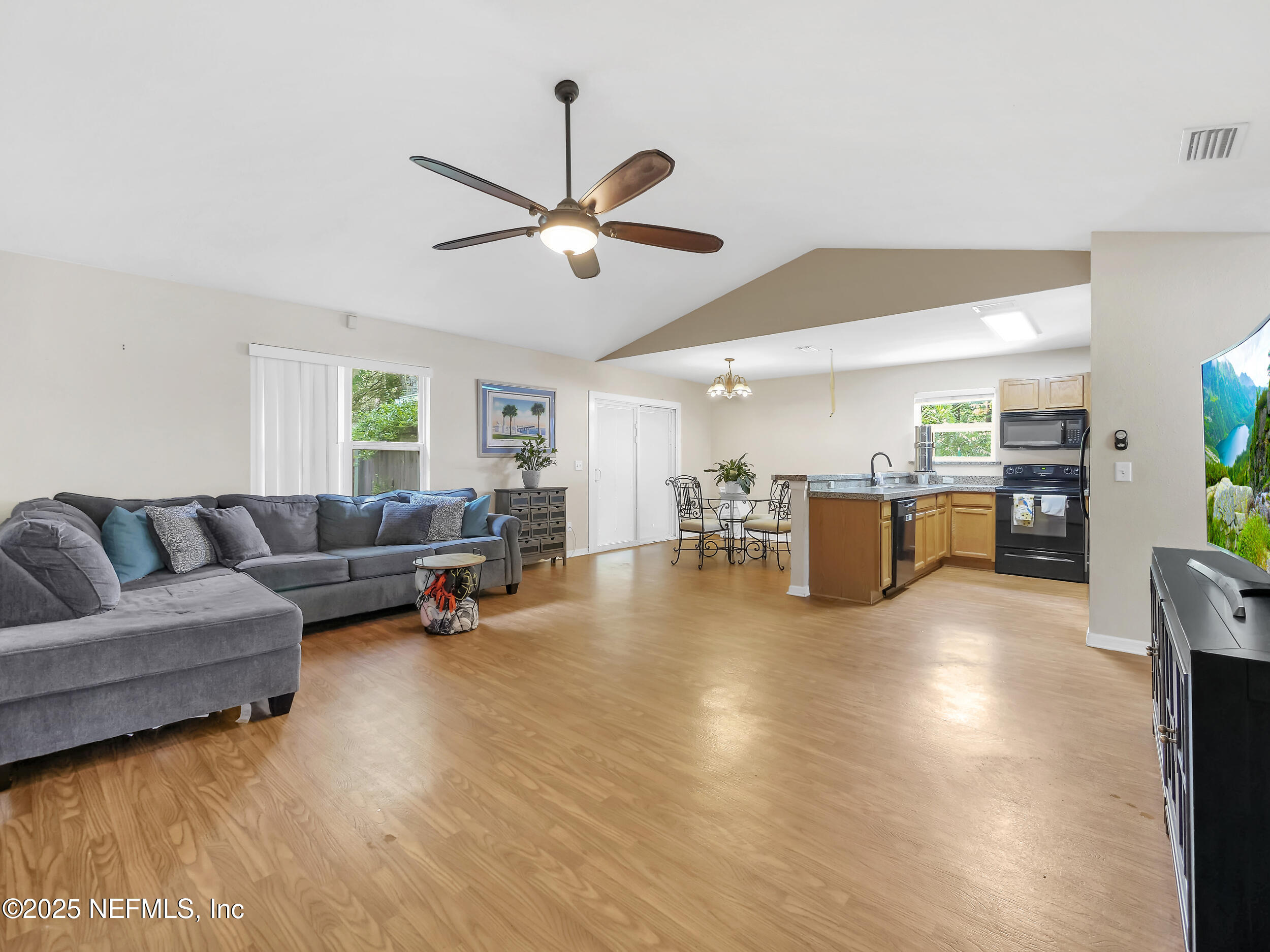 1193 4 Mile Road St. Augustine, FL 32084 - Photo 7 of 54 a living room with furniture and kitchen view