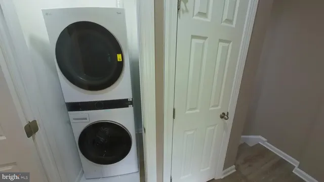 a view of a hallway with washer and dryer