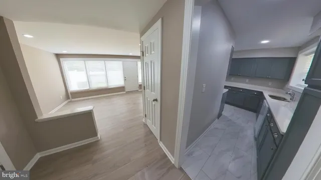 a kitchen with stainless steel appliances a stove a refrigerator and a sink