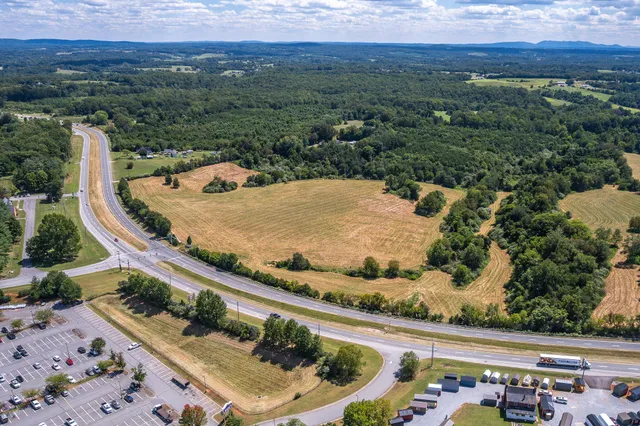 an aerial view of ocean and residential houses