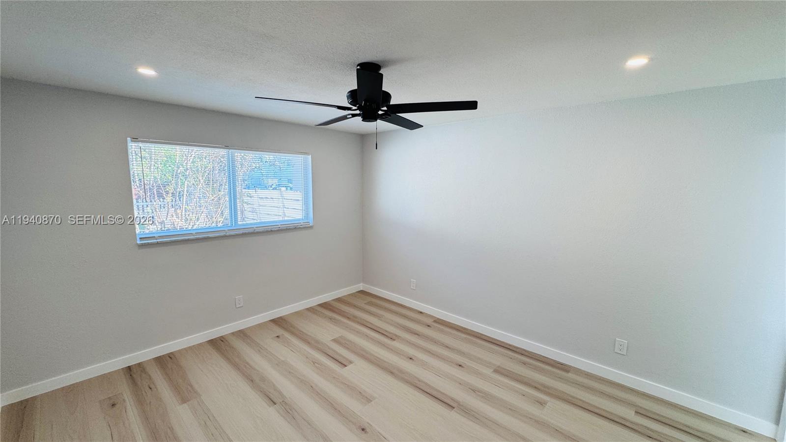 808 Northeast 2nd Street, Unit A Hallandale Beach, FL 33009 - Photo 5 of 11 wooden floor in an empty room