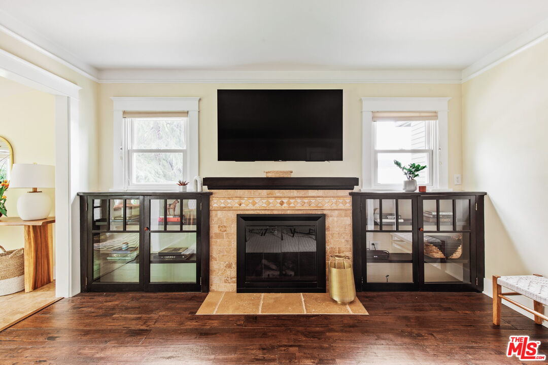 5159 Shearin Avenue Los Angeles, CA 90041 - Photo 13 of 47 a living room with fireplace and a flat screen tv