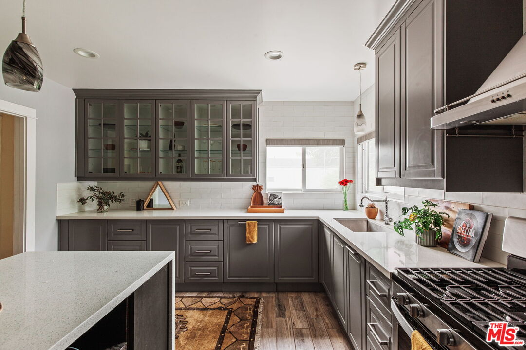 5159 Shearin Avenue Los Angeles, CA 90041 - Photo 25 of 47 a kitchen with a sink stove and cabinets