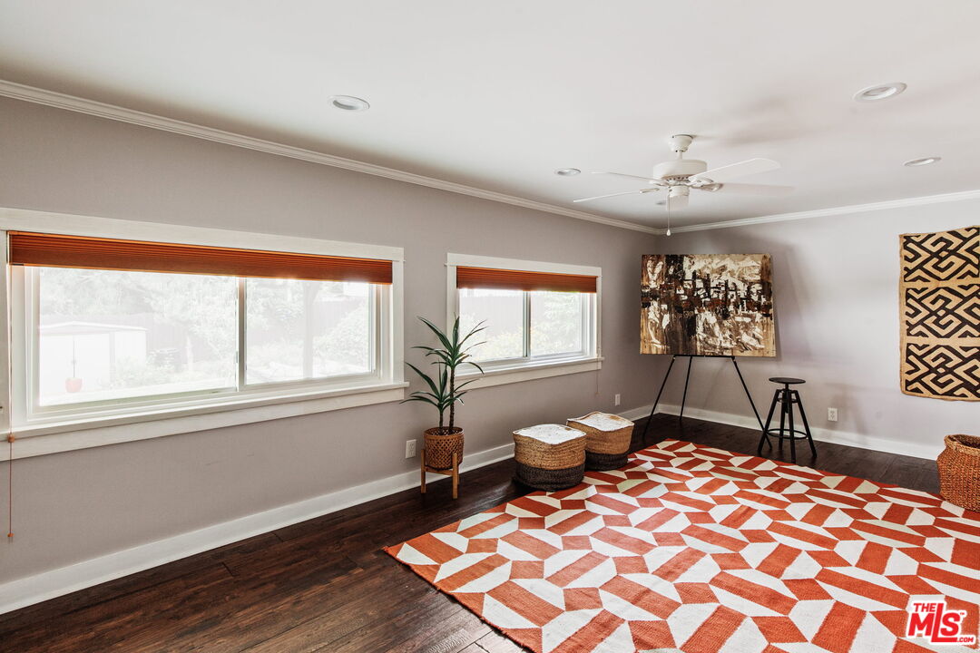 5159 Shearin Avenue Los Angeles, CA 90041 - Photo 26 of 47 a bedroom with a bed and wooden floor