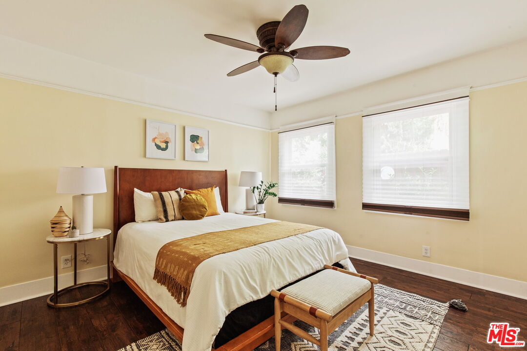 5159 Shearin Avenue Los Angeles, CA 90041 - Photo 34 of 47 a bedroom with a bed chandelier and a window