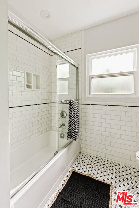5159 Shearin Avenue Los Angeles, CA 90041 - Photo 37 of 47 a bathroom with a bathtub and shower