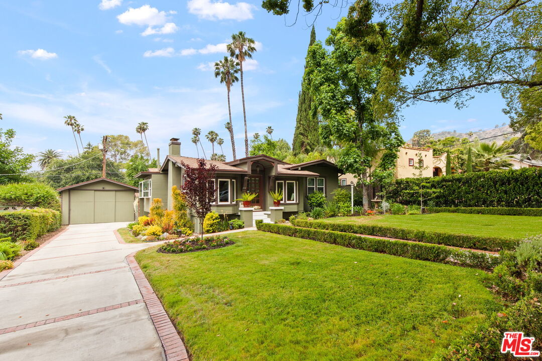 5159 Shearin Avenue Los Angeles, CA 90041 - Photo 4 of 47 a view of a swimming pool with a patio and a yard