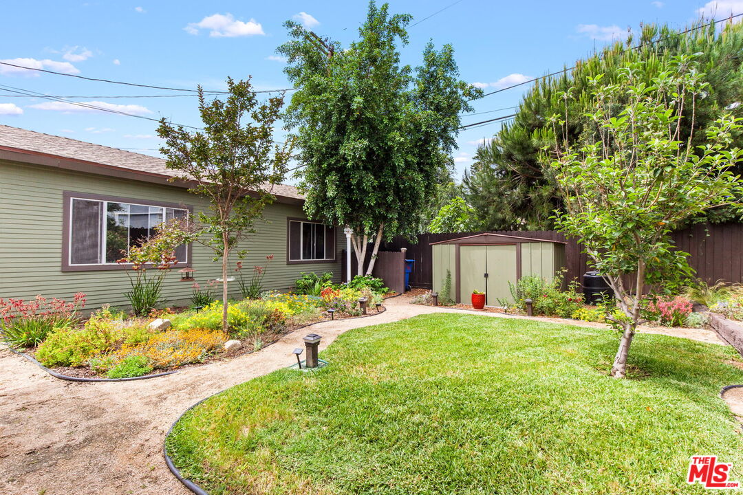 5159 Shearin Avenue Los Angeles, CA 90041 - Photo 41 of 47 a front view of a house with a yard and trees