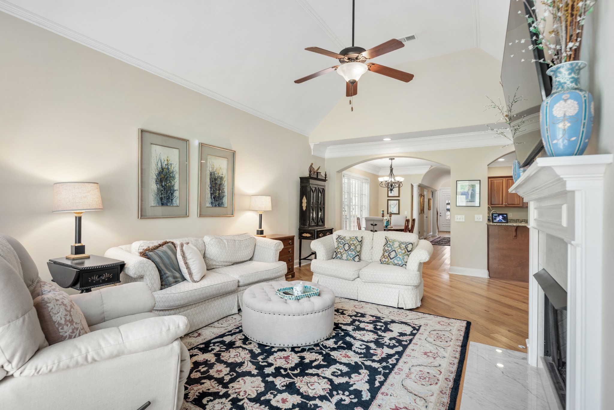 114 Nickolas Circle Lebanon, TN 37087 - Photo 13 of 53 a living room with furniture a chandelier and a rug