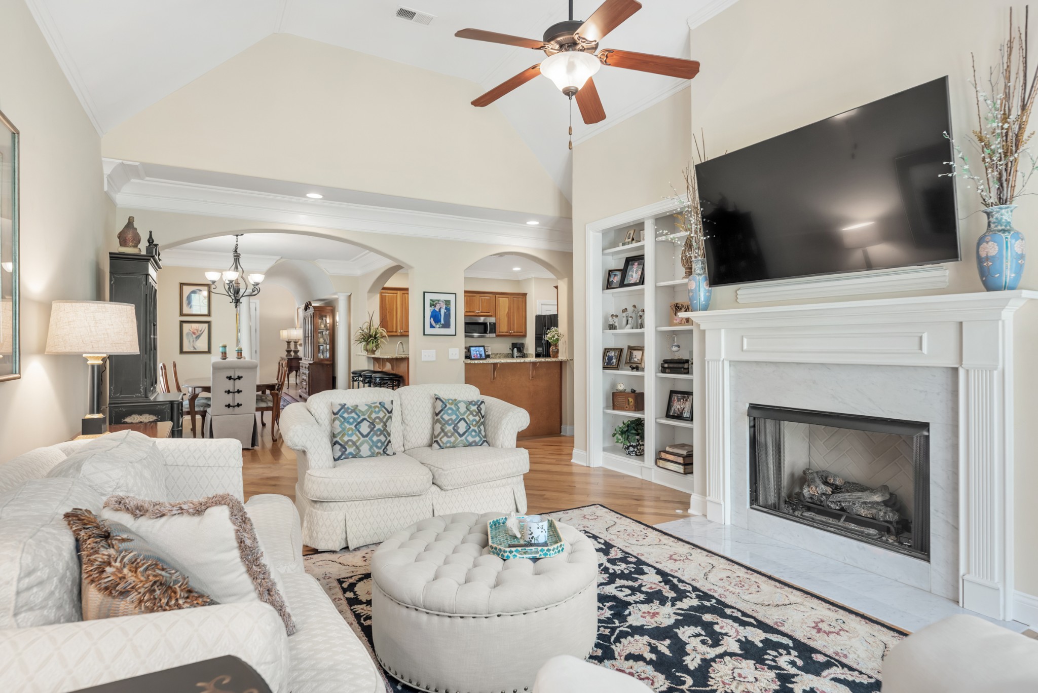 114 Nickolas Circle Lebanon, TN 37087 - Photo 14 of 53 a living room with furniture a flat screen tv and a fireplace
