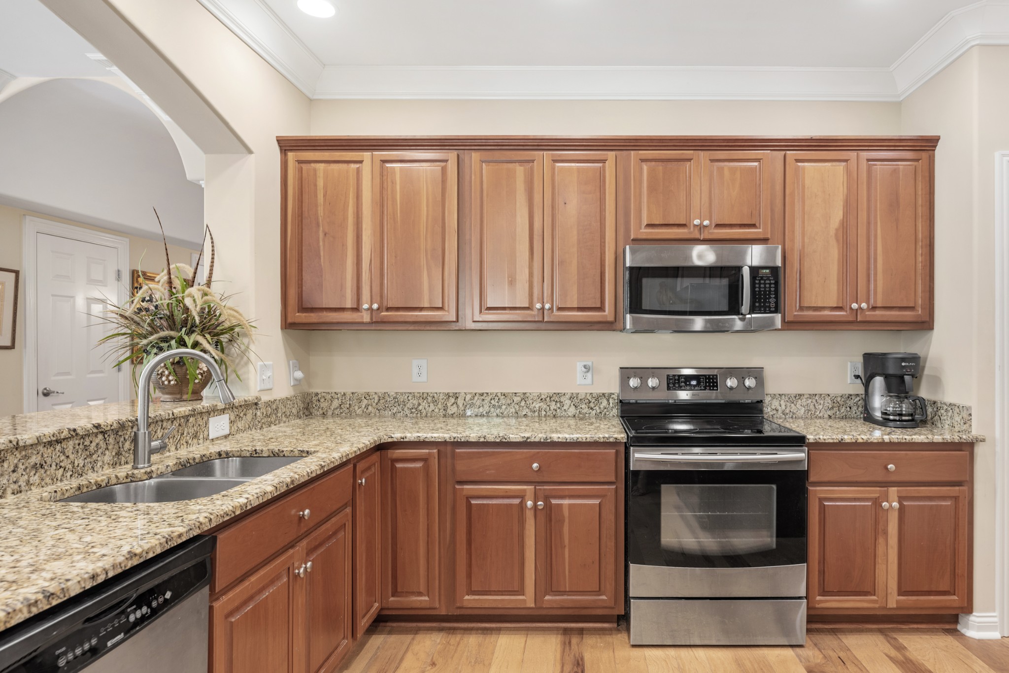 114 Nickolas Circle Lebanon, TN 37087 - Photo 18 of 53 a kitchen with granite countertop a sink stove and microwave
