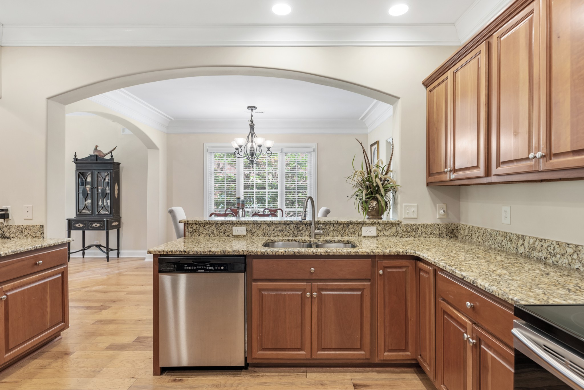 114 Nickolas Circle Lebanon, TN 37087 - Photo 19 of 53 a kitchen with stainless steel appliances granite countertop wooden cabinets a dining table and chairs