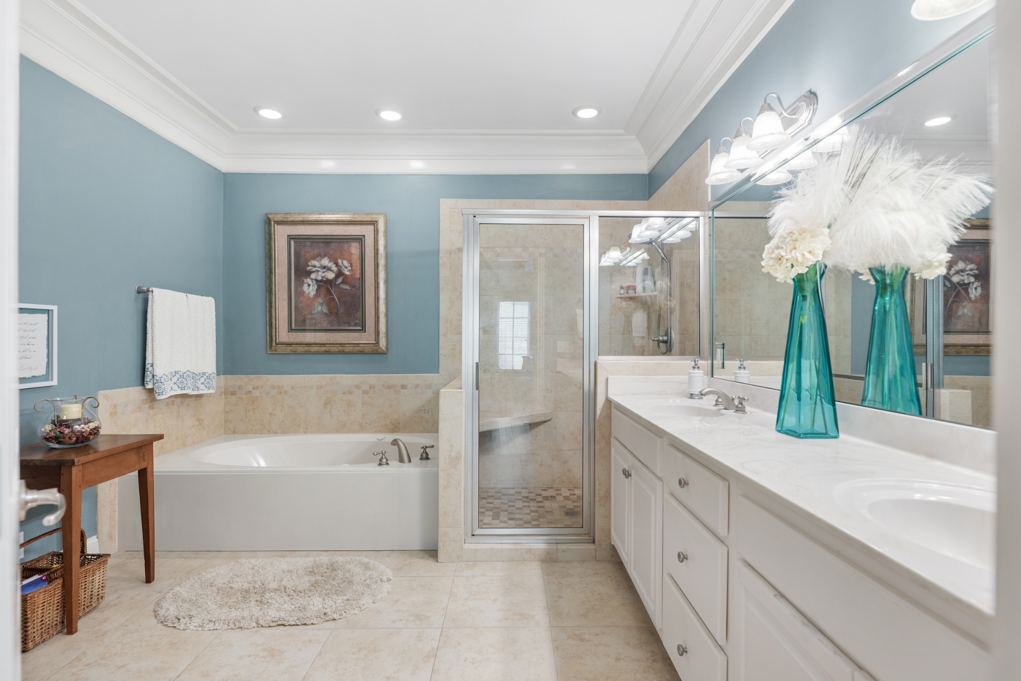 114 Nickolas Circle Lebanon, TN 37087 - Photo 27 of 53 a bathroom with a double vanity sink a large mirror and a bathtub