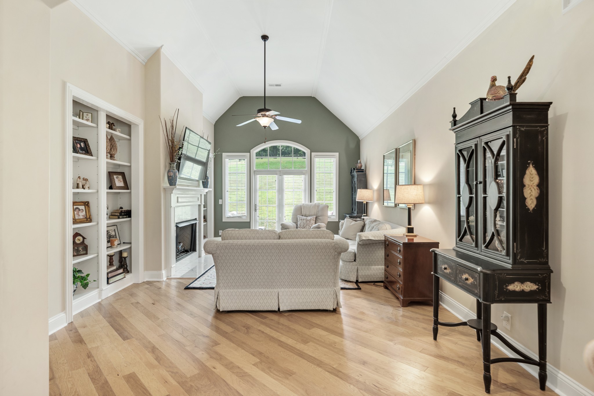 114 Nickolas Circle Lebanon, TN 37087 - Photo 8 of 53 a living room with furniture a window and a chandelier
