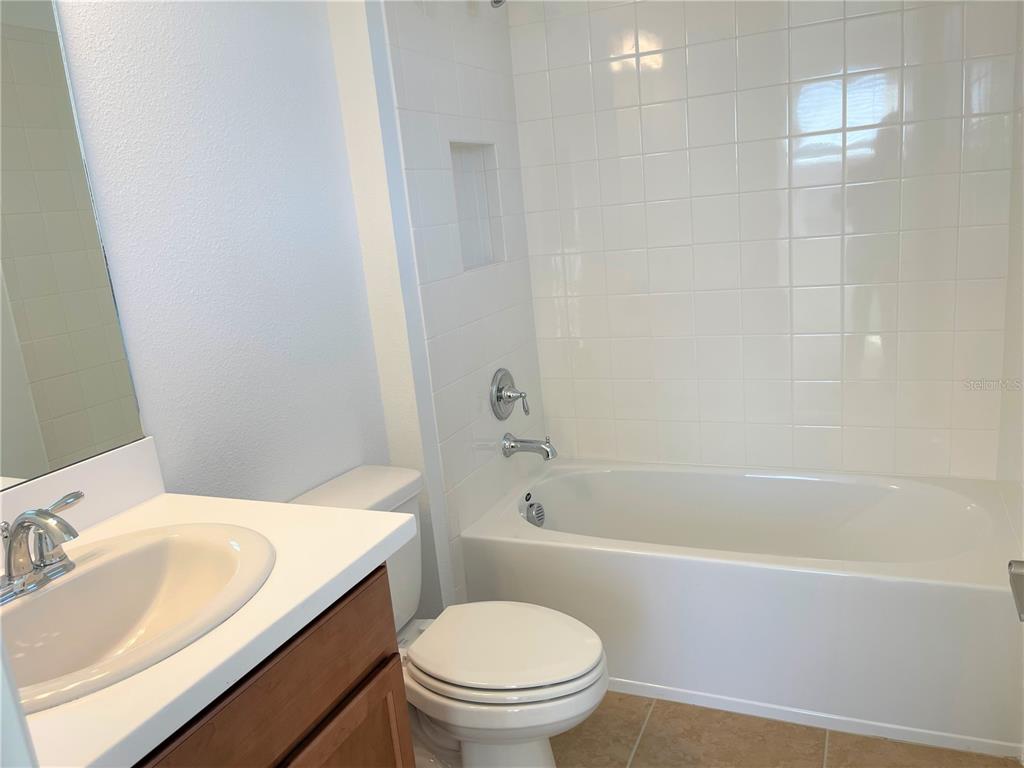 7775 Nightfall Terrace Sarasota, FL 34241 - Photo 13 of 36 a bathroom with a sink a toilet and a bathtub