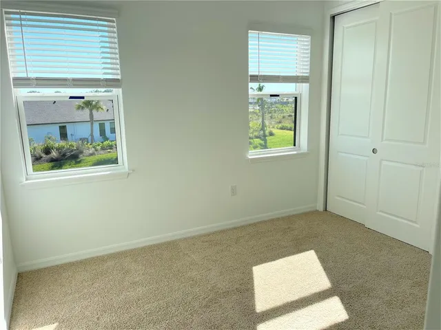 a view of a hallway with windows