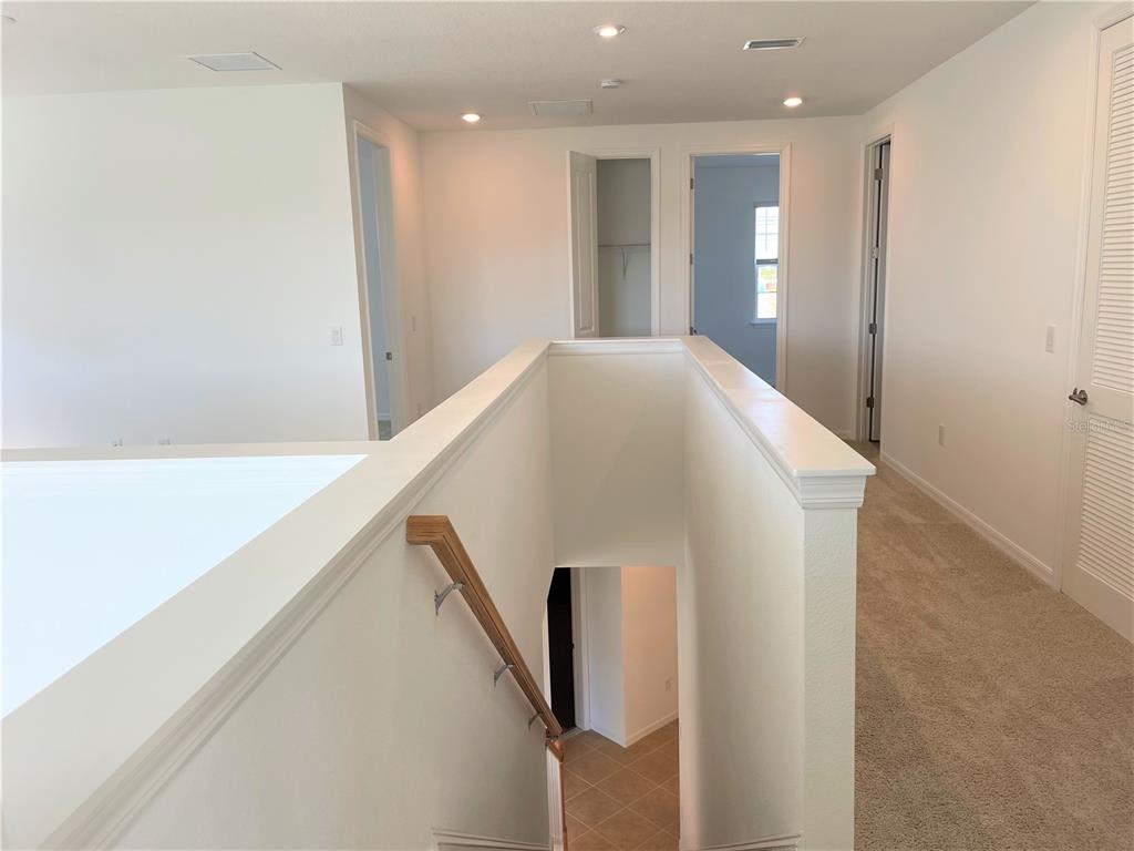 7775 Nightfall Terrace Sarasota, FL 34241 - Photo 15 of 36 a view of a hallway with windows