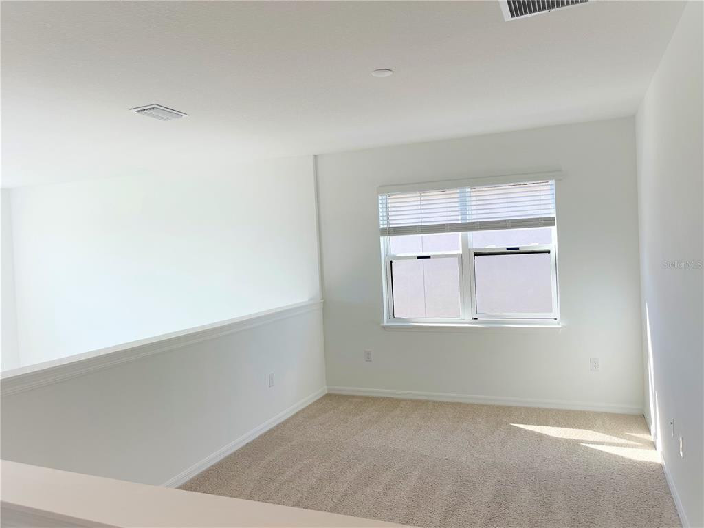 7775 Nightfall Terrace Sarasota, FL 34241 - Photo 17 of 36 an empty room with a window