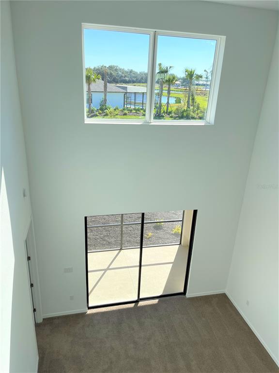 7775 Nightfall Terrace Sarasota, FL 34241 - Photo 18 of 36 an empty room with windows