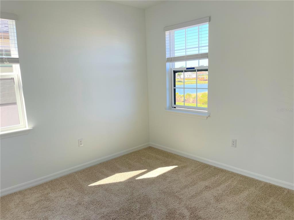 7775 Nightfall Terrace Sarasota, FL 34241 - Photo 19 of 36 an empty room with a window