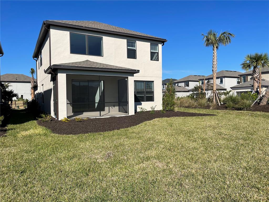 7775 Nightfall Terrace Sarasota, FL 34241 - Photo 28 of 36 a view of a house with a yard